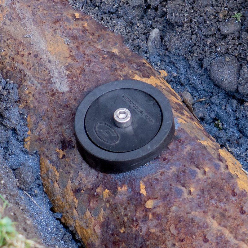 Access Point installed on a buried cast iron pipe in a trench