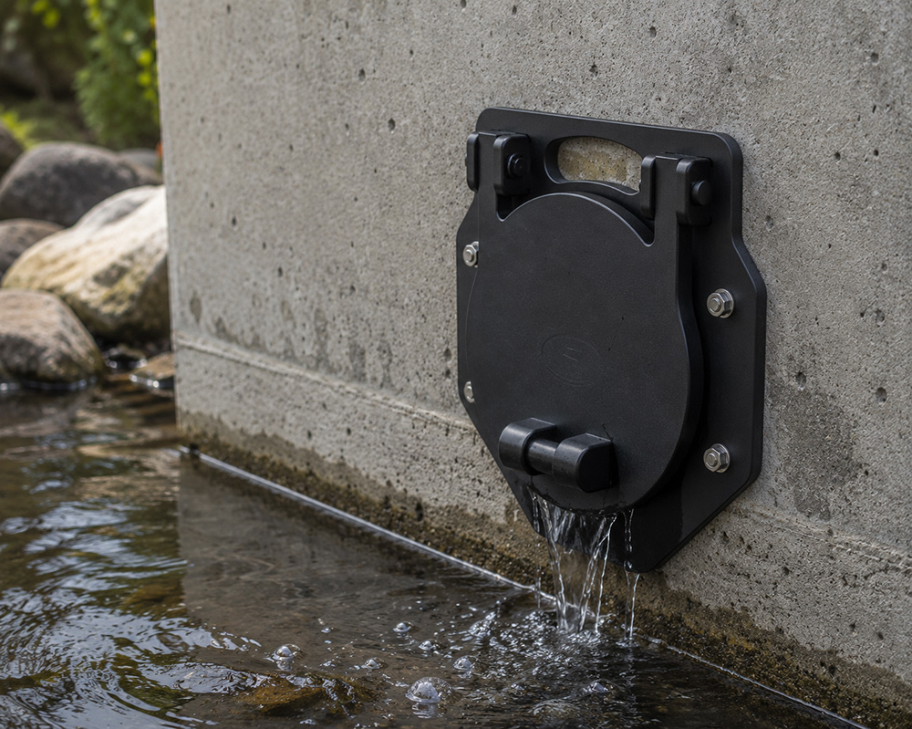 Fernco HMWPE flap valve installed at a municipal stormwater discharge point