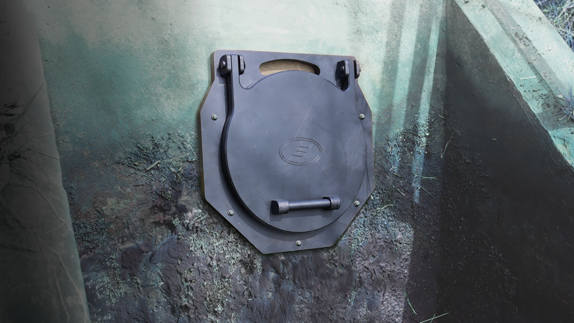 Fernco HMWPE wall mount flap valve on a concrete outfall
