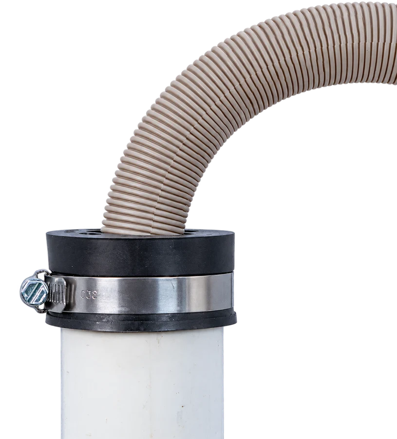 Washer drain hose held in a Fernco Hose Grip clamped on top of a white standpipe